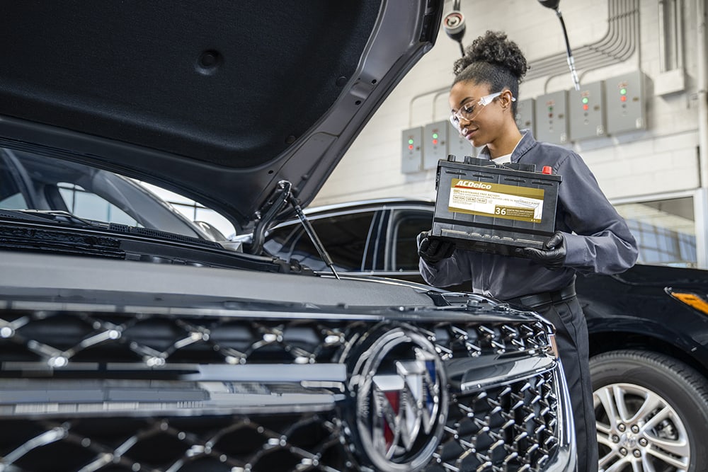 Service tech working on vehicle