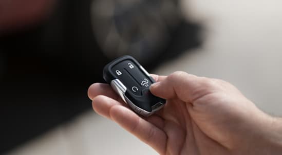 A hand holding a car key