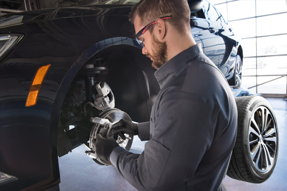 A service guy installing a tire
